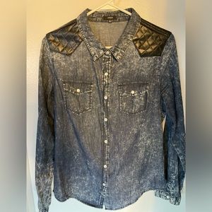 Cute, stylish, fitted dark stonewash shirt with quilted pleather adornment.